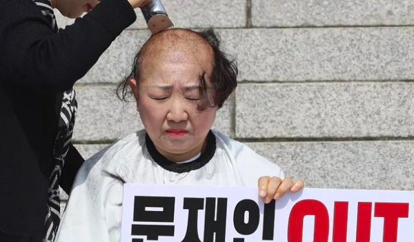韩国教师削发抗议,韩国起诉日本核污水入海图9